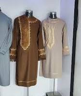 Brown and beige embroidered kurtas on mannequins